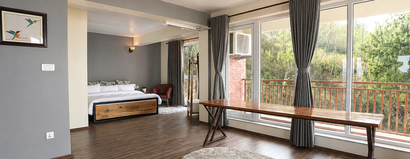 StillPoint apartment interior with panoramic mountain views through floor-to-ceiling windows