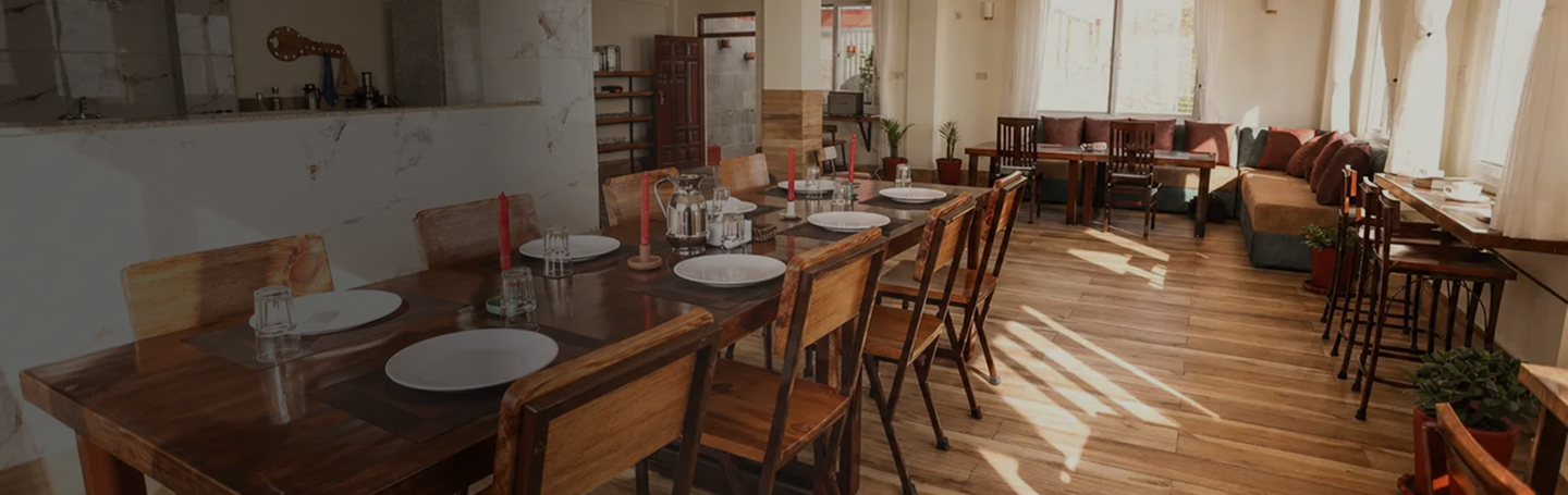 Still point Retreat dining area with wooden tables and natural light