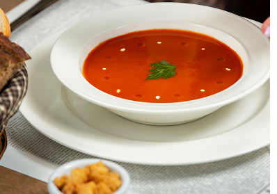 Tomato soup with crackers grated cheese